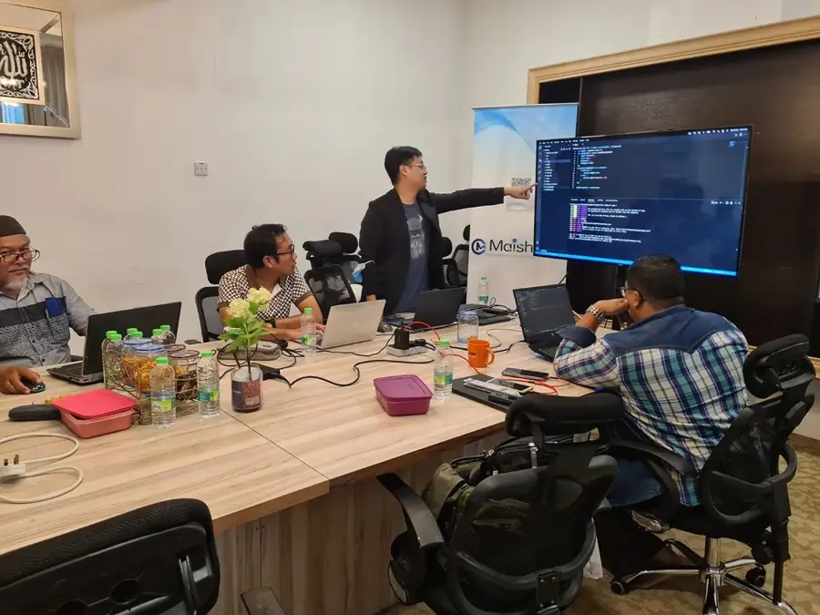 Trainer guiding participants through a build-along coding session